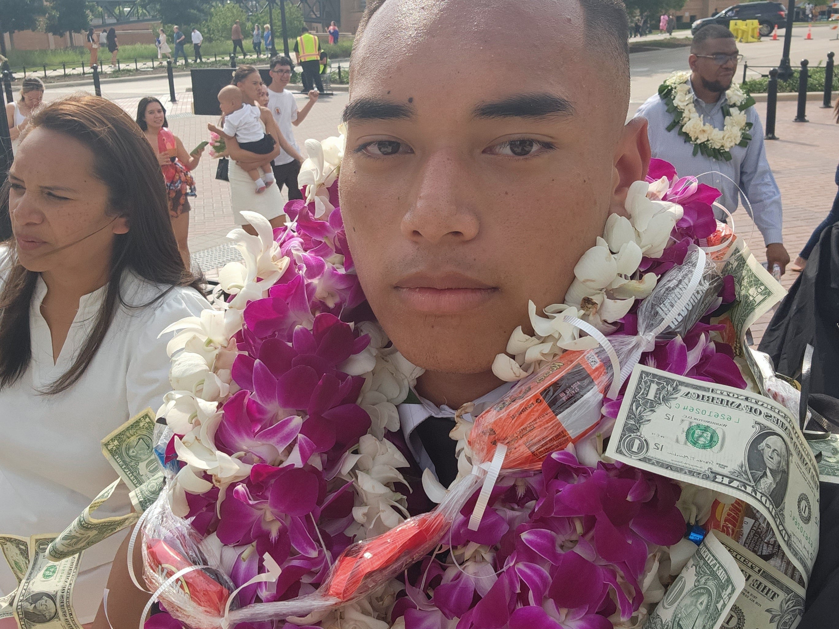 Texas high school graduation with hawaiian flower and money leis