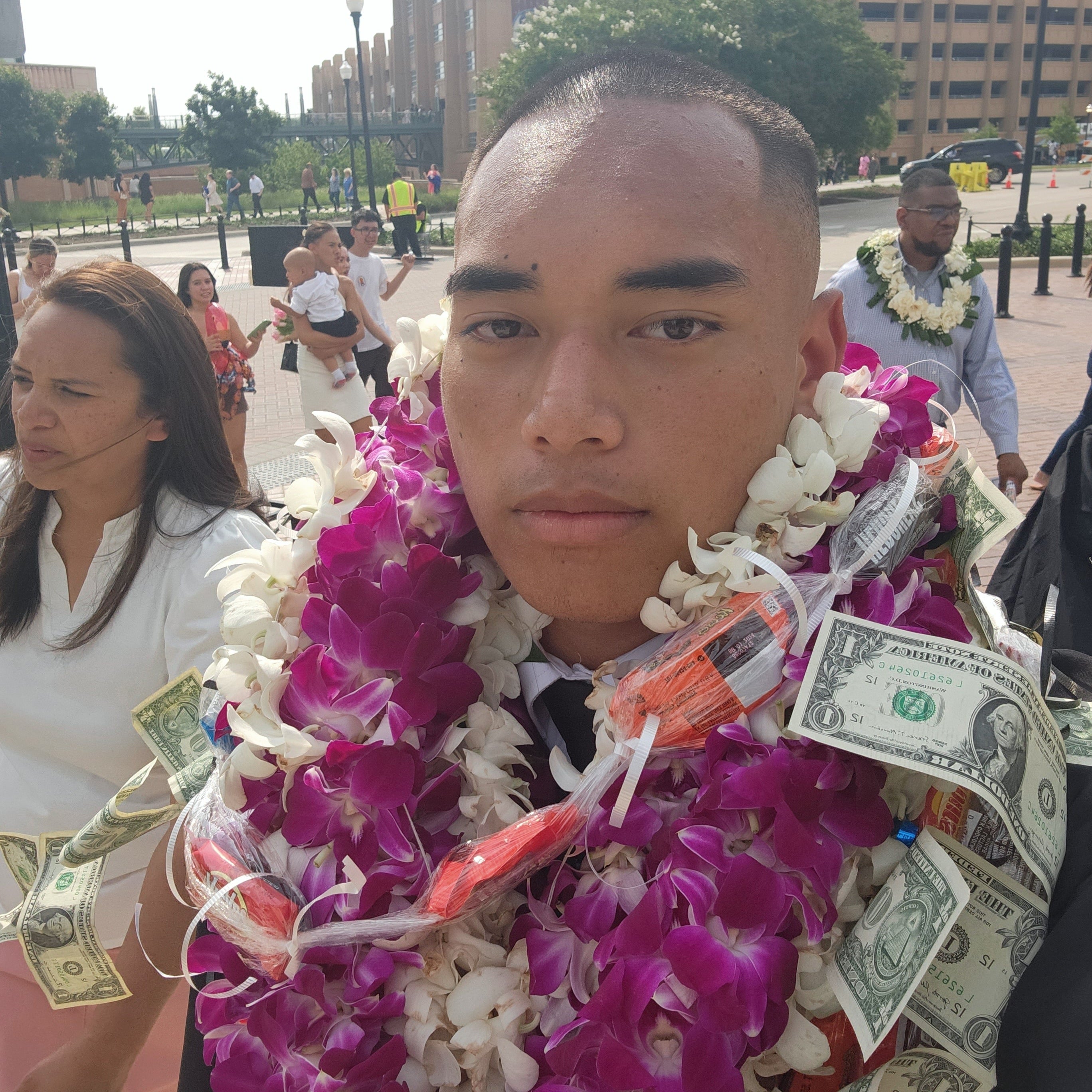 Texas high school graduation with hawaiian flower and money leis