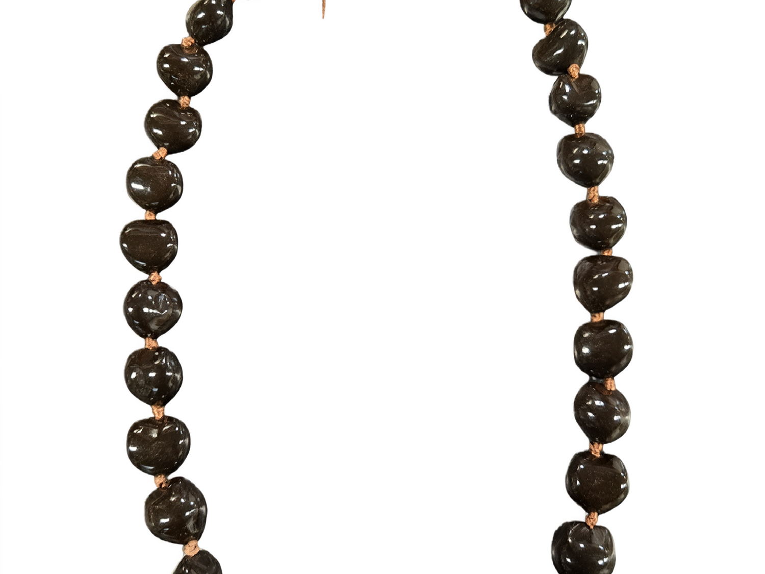 Hand-strung brown kukui nut lei with ribbon tie on a white background