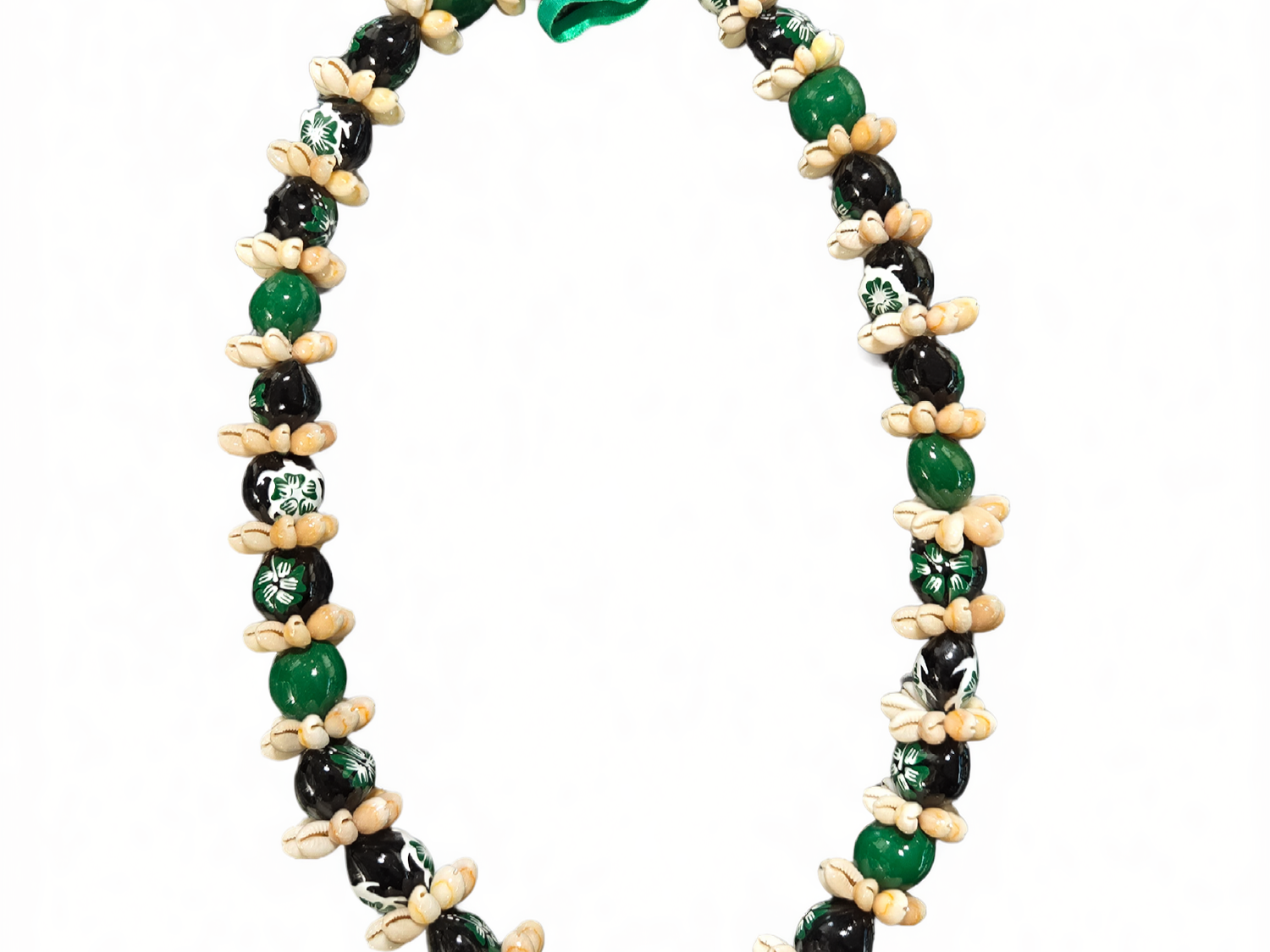 Green kukui nut lei with black beads and natural shell accents, isolated on white