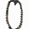 Tiger kukui nut lei with polished dark kukui nuts and cream marbled markings tied with a black ribbon on a white background