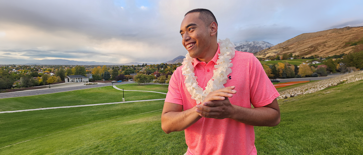 Polynesian man wearing white orchid lei in Utah