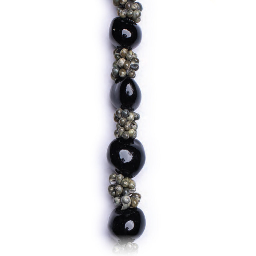 Kona Coast Kukui & Mongo Shell Lei of black kukui nuts alternating with green mongo shells